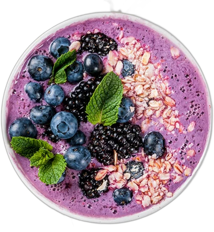 Açaí smoothie bowl with blueberries, blackberries and mint